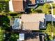 Aerial view of home with private screened pool and lush landscaped fenced backyard at 11730 Kennington Ct, Orlando, FL 32824