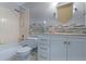 Clean bathroom with shower, tub, and vanity with sink at 11730 Kennington Ct, Orlando, FL 32824