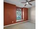 Inviting bedroom with neutral walls, carpet, and a window with natural light at 11730 Kennington Ct, Orlando, FL 32824