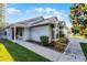 Charming single-story home with a well-manicured lawn and mature landscaping at 11730 Kennington Ct, Orlando, FL 32824