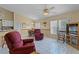 Cozy living area with tile flooring, comfortable seating, and ample natural light at 11730 Kennington Ct, Orlando, FL 32824