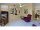 Comfortable living room with tile floors and a ceiling fan at 11730 Kennington Ct, Orlando, FL 32824