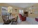 Open living area with tile floors, casual furnishings, and natural light at 11730 Kennington Ct, Orlando, FL 32824