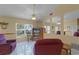 Comfortable living room with neutral walls, tile floors, and a ceiling fan at 11730 Kennington Ct, Orlando, FL 32824