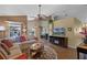 A spacious living room with a ceiling fan, hardwood floors, and a comfortable sectional at 11730 Kennington Ct, Orlando, FL 32824