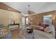 Comfortable living room with ample seating, warm tones, and hardwood floors at 11730 Kennington Ct, Orlando, FL 32824