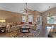 Cozy living room featuring a fan, comfortable sectional sofa, and hardwood floors at 11730 Kennington Ct, Orlando, FL 32824