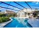 Inviting screened pool area featuring a clean pool, patio, and landscaped surroundings at 11730 Kennington Ct, Orlando, FL 32824