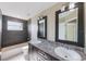 Bathroom featuring double sinks and a shower-tub combo at 12303 Bohannon Blvd, Orlando, FL 32824