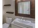 Bathroom with floating shelves and a large mirror at 12303 Bohannon Blvd, Orlando, FL 32824