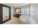 Bathroom with a double sink vanity and large soaking tub at 12303 Bohannon Blvd, Orlando, FL 32824