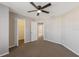 Neutral bedroom featuring a ceiling fan and a view into the hall at 12303 Bohannon Blvd, Orlando, FL 32824