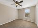 Cozy bedroom with carpet flooring, ceiling fan and window letting in natural light at 12303 Bohannon Blvd, Orlando, FL 32824