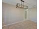 Dining area featuring modern lighting, neutral paint, and stylish tile flooring at 12303 Bohannon Blvd, Orlando, FL 32824