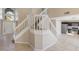 Spacious entryway featuring a grand staircase, tile flooring, and plenty of natural light at 12303 Bohannon Blvd, Orlando, FL 32824