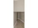 The hallway features neutral colored walls and tiles that run along the base of the walls at 12303 Bohannon Blvd, Orlando, FL 32824