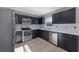 Modern kitchen showcasing stainless steel appliances and updated countertops at 12303 Bohannon Blvd, Orlando, FL 32824