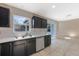 Updated kitchen featuring stainless steel appliances and a view to dining area at 12303 Bohannon Blvd, Orlando, FL 32824