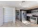 Bright kitchen with stainless steel refrigerator and ample storage space at 12303 Bohannon Blvd, Orlando, FL 32824