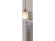 Modern pendant light with metal cage and frosted glass, blending style and functionality at 12303 Bohannon Blvd, Orlando, FL 32824