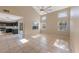 Open concept living space with tile flooring, high ceilings, and abundant natural light at 12303 Bohannon Blvd, Orlando, FL 32824