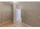 Walk-in closet with built-in shelving and door to more storage at 12303 Bohannon Blvd, Orlando, FL 32824