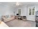 Bedroom with a sofa, desk, shutters, and neutral decor perfect for an office space at 1321 Artisan E Ave, Celebration, FL 34747