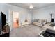 Carpeted room with sofa, desk, and television, with access to hallway at 1321 Artisan E Ave, Celebration, FL 34747