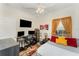This bedroom offers a workstation and is designed with an eye-catching orange and gray color scheme at 1321 Artisan E Ave, Celebration, FL 34747