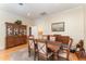 Formal dining room features hardwood floors, a large china cabinet, and seating for six at 1321 Artisan E Ave, Celebration, FL 34747