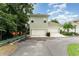 Two story home with two-car garage, basketball hoop, and freshly paved driveway, ideal for Gathering fun at 1321 Artisan E Ave, Celebration, FL 34747