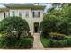 Charming home entrance with manicured bushes along the walkway to the door and a wreath at 1321 Artisan E Ave, Celebration, FL 34747