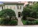 Charming home featuring lush landscaping, sidewalk and classic black shutters and door for an inviting entrance at 1321 Artisan E Ave, Celebration, FL 34747