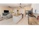 Open kitchen with granite countertops, stainless appliances, a central island, and an eat-in bar at 1321 Artisan E Ave, Celebration, FL 34747