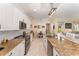 Bright kitchen with granite countertops, stainless steel appliances, open to living room and dining room at 1321 Artisan E Ave, Celebration, FL 34747