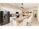 Bright kitchen with granite countertops, stainless steel appliances, and a center island at 1321 Artisan E Ave, Celebration, FL 34747