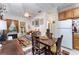 Inviting living space with hardwood floors, dining table, and access to the kitchen at 1321 Artisan E Ave, Celebration, FL 34747