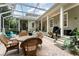 Spacious screened-in patio with brick pavers and comfortable seating areas at 1321 Artisan E Ave, Celebration, FL 34747