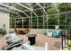 Spacious patio with brick floors, fire pit, multiple seating areas, and lush landscaping at 1321 Artisan E Ave, Celebration, FL 34747