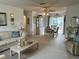 Open-concept living area connecting the living room and dining space, perfect for gatherings at 1410 Sanchez Ct, Lady Lake, FL 32159