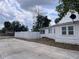 Image shows the back side of the home, and fence at 1413 11Th St, St Cloud, FL 34769