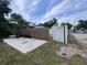Backyard view showing detached structure, fenced yard, and concrete slab at 1413 11Th St, St Cloud, FL 34769