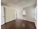 Bedroom with dark hardwood floors and large window with window AC unit at 1413 11Th St, St Cloud, FL 34769
