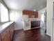 An efficient kitchen with appliances and access to a bathroom at 1413 11Th St, St Cloud, FL 34769