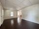 The property features a living room with beautiful wood floors and plenty of natural light at 1413 11Th St, St Cloud, FL 34769