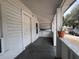 Covered front porch offers shade and a place to enjoy the outdoors at 1413 11Th St, St Cloud, FL 34769