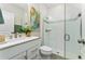 A stylish bathroom featuring modern fixtures, a glass-enclosed shower, and elegant decor at 14416 Orchid Island Dr, Orlando, FL 32827