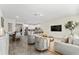 Open living space with kitchen, dining, and living areas offering a seamless flow for modern living and entertaining at 14416 Orchid Island Dr, Orlando, FL 32827