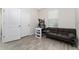 A cozy office with a neutral color palette, desk, and a comfortable sofa at 14416 Orchid Island Dr, Orlando, FL 32827