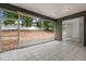 The tiled lanai has screens to keep out the bugs and a view of the large backyard at 14610 Wishing Wind Way, Clermont, FL 34711